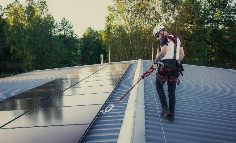 photovoltaic maintenance on a metal roof