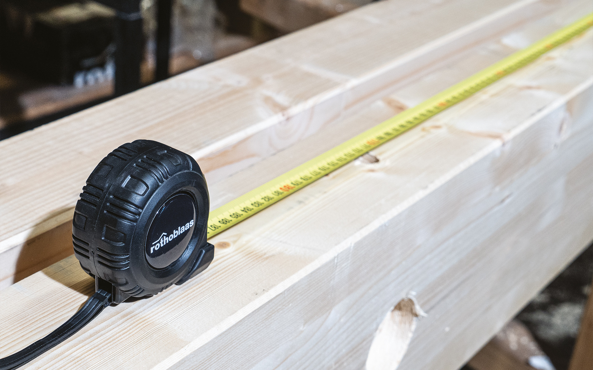 RBMET measuring tape on timber background