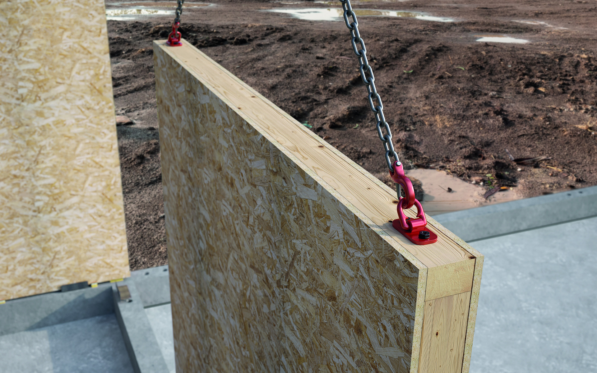RAPTOR MINI installed on a timber frame wall panel during lifting and transport on site