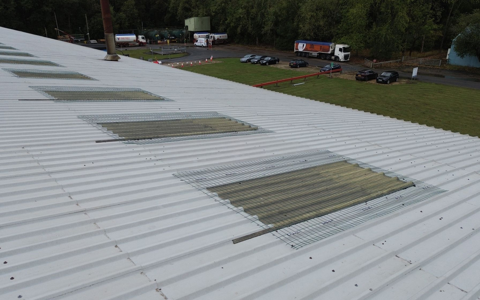 Skylight fall protection system installed on industrial metal roof to secure fragile rooflights during maintenance 