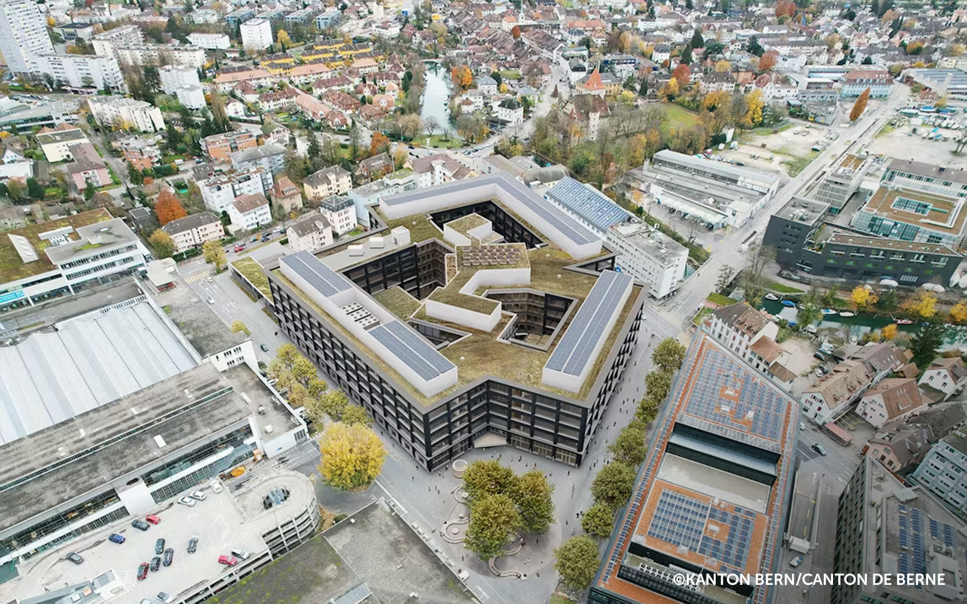 Aerial view of Biel campus with large-scale engineered timber building and post and beam structure integrated in urban context 
