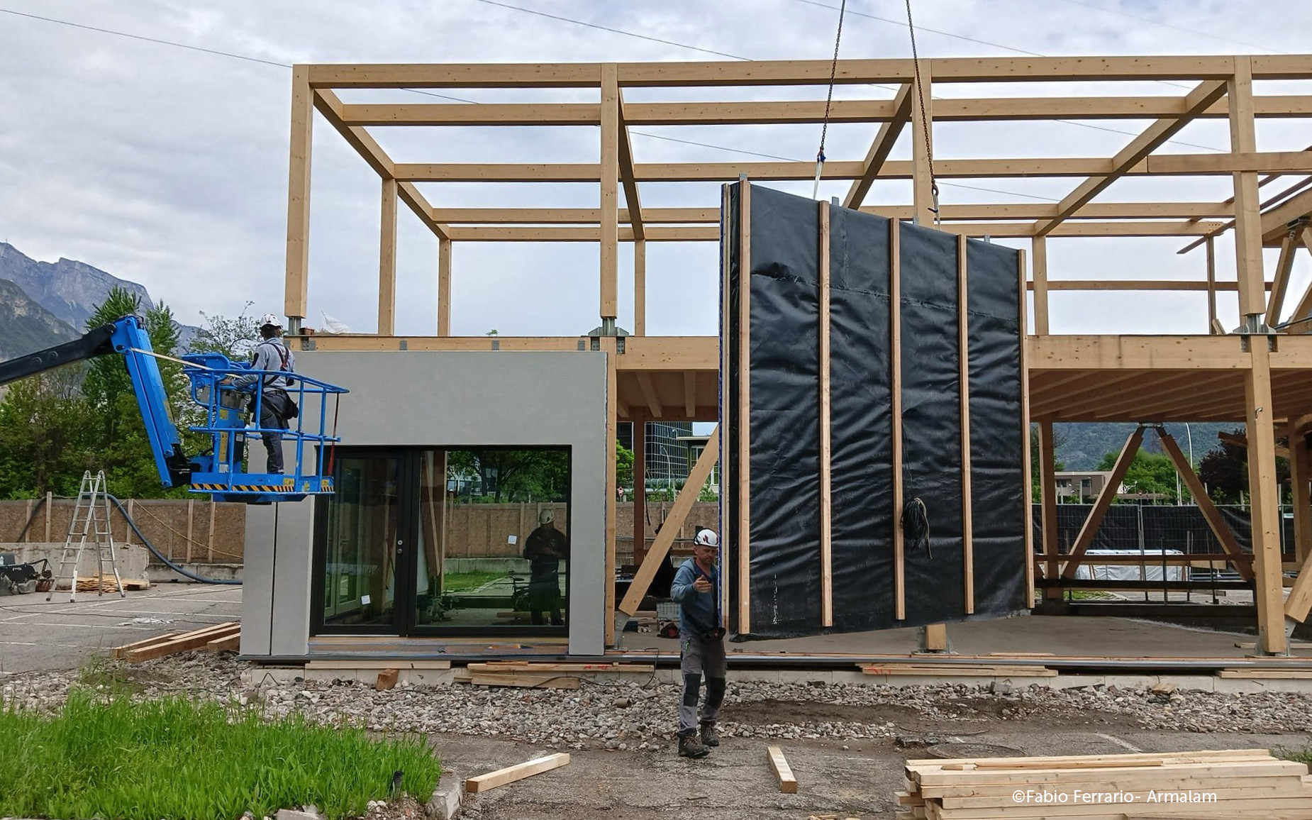 Prefabricated timber facade panel installation on site for off-site retrofit and building envelope upgrade