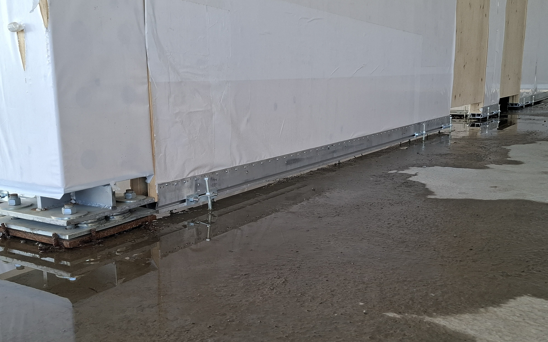 ALU START profile protecting timber panel base from rising damp on site